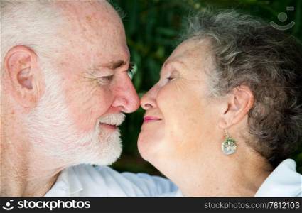 Closeup view of a senior couple in love, flirting with each other.