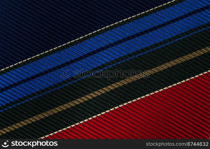 Closeup view of a striped neck tie, could be used as a background.