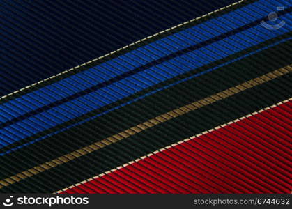 Closeup view of a striped neck tie, could be used as a background.
