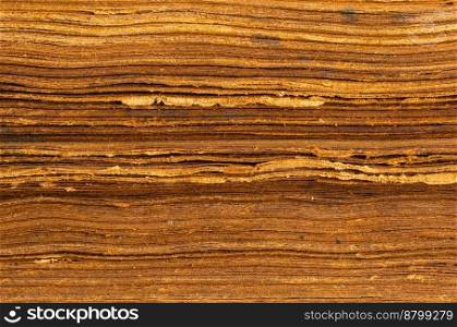 Closeup view of abstract shabby brown paper background of old closed book pages in horizontal format.