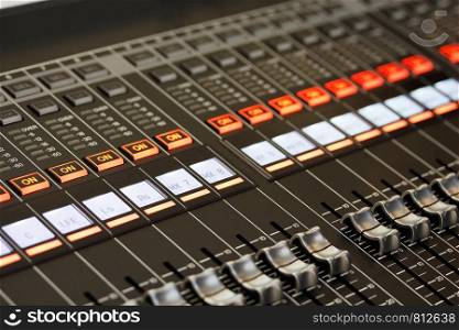 Closeup view of digital sound mixing console. Selective focus.