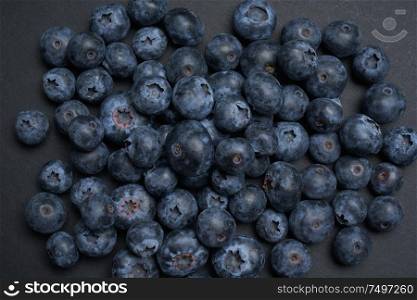 Closeup view of fresh blueberry on black background