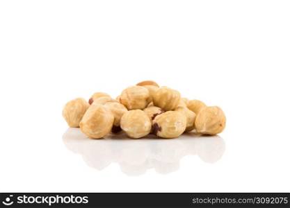 Closeup view of hazelnuts nuts pile on white background