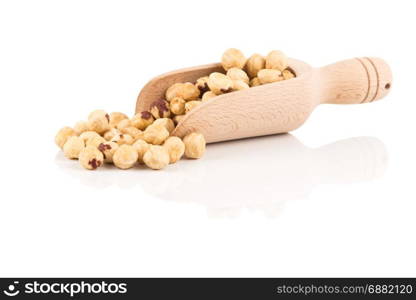 Closeup view of hazelnuts nuts pile on white background in wooden scoop