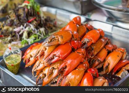 Closeup view of heap of fresh cooked red crabs at asian seafood market