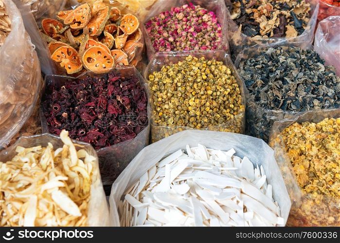 Closeup view of heaps of tea, dried herbs and grocery at traditional chinese street market in asian town. Bangkok, Thailand