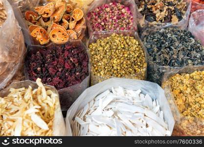 Closeup view of heaps of tea, dried herbs and grocery at traditional chinese street market in asian town. Bangkok, Thailand