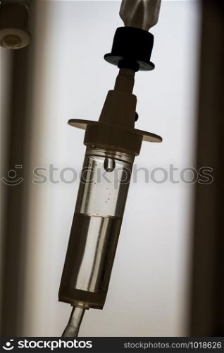 Closeup view of intravenous infusion drip equipment in hospital. Intravenous drip equipment in hospital