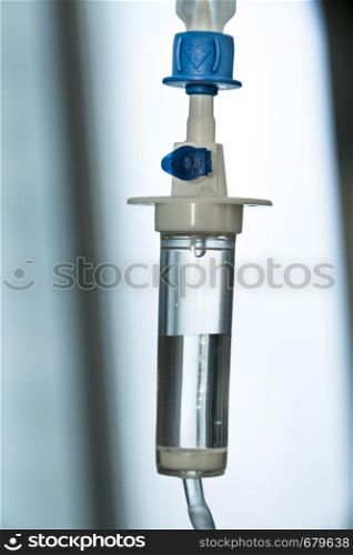 Closeup view of intravenous infusion drip equipment in hospital. Intravenous drip equipment in hospital