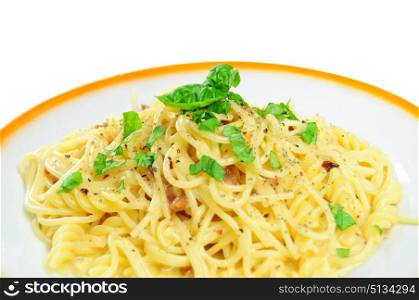 Closeup view of spaghetti carbonara in plate, isolated