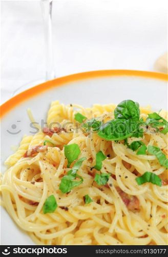 Closeup view of spaghetti carbonara on table