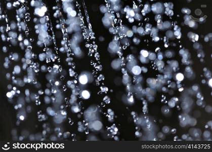 closeup view of water drops on black background