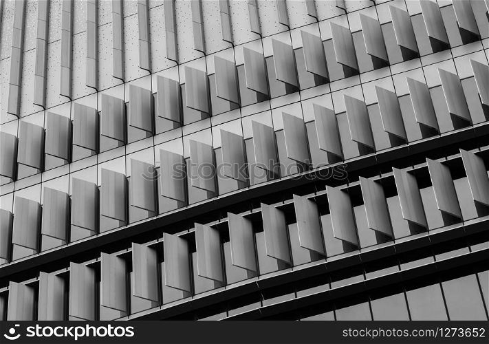 Closeup window of skyscraper glass office building. Exterior commercial building. Modern architecture design. Facade of modern business glass building. Window of glass building texture background.