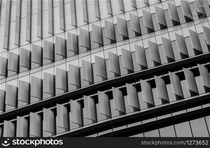 Closeup window of skyscraper glass office building. Exterior commercial building. Modern architecture design. Facade of modern business glass building. Window of glass building texture background.