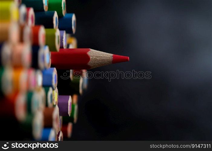 Closeup with a group of colored pencils, selected focus, red