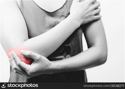 closeup women elbow pain/injury with red highlights on pain area. closeup women elbow pain/injury with red highlights on pain area with white backgrounds, healthcare and medical concept - B&W filter