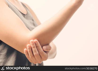 closeup women elbow pain/injury with white backgrounds, healthca. closeup women elbow pain/injury with white backgrounds, healthcare and medical concept