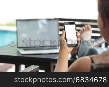 closeup women holding phone white screen sitting relax outdoor lifestyle