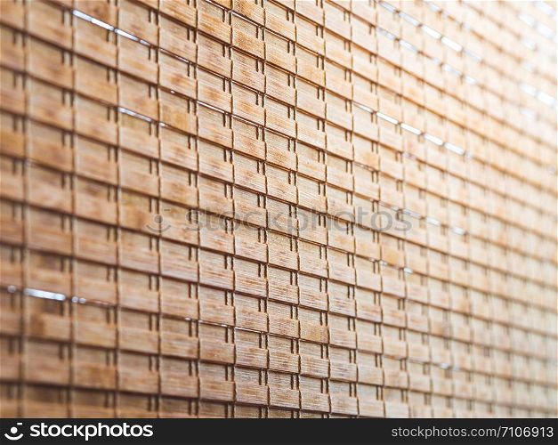Closeup wooden blind textures with yellow sunlight in cafeteria.