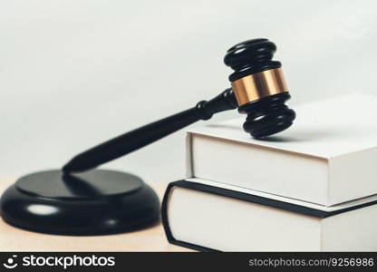 Closeup wooden gavel hammer and law book in empty law firm or white lawyer office background as justice and legal system by lawyer and judge, Legal authority and fairness in trial concept. equility. Black wooden gavel and book on office desk as justice and legal. equility