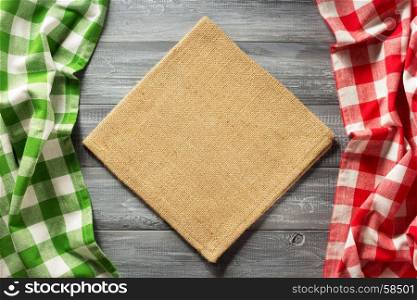 cloth checked napkin on wooden background