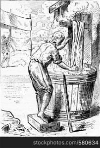Cloth dyer, vintage engraved illustration. Magasin Pittoresque (1882).