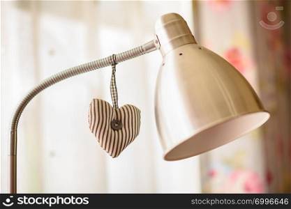 Cloth heart decoration hanging on lamp pillar