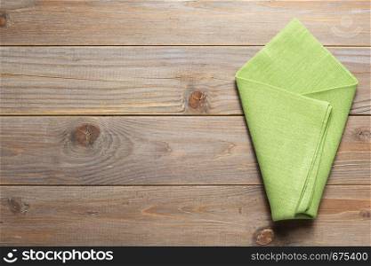 cloth napkin on at rustic wooden plank board table background, top view