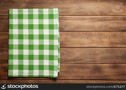 cloth napkin on at rustic wooden plank board table background, top view