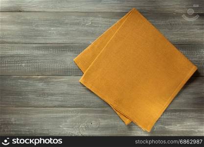 cloth napkin on wooden table background
