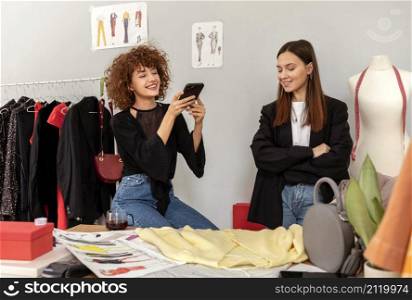 clothes designers working store