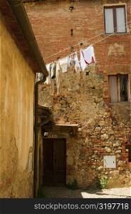 Clothes hanging to dry on a clothesline, Monteriggioni, Siena Province, Tuscany, Italy