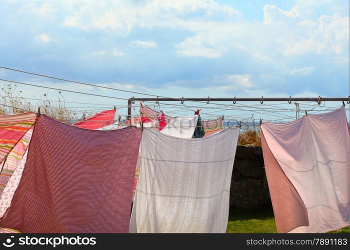 clothes hanging to dry on a laundry line blue sky background