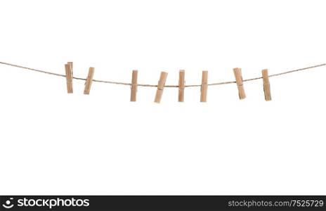 Clothes line with pegs isolated over white background. Clothespins on rope