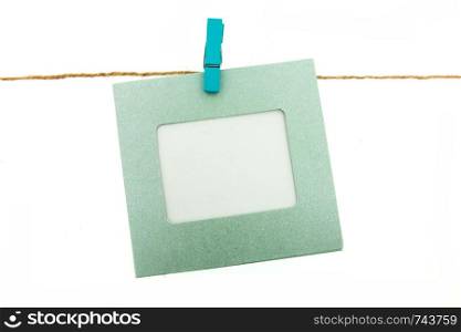 clothespin and frame card hanging on rope with colorful isolated on white background
