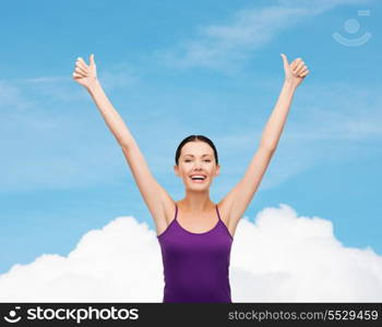 clothing design and happy people concept - smiling girl in blank purple tank top showing thumbs up