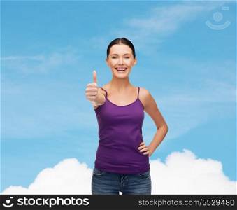 clothing design and happy people concept - smiling girl in blank purple tank top showing thumbs up