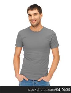 clothing design concept - handsome man in blank grey t-shirt