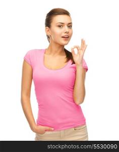clothing design, health and breast cancer awareness concept - smiling girl in blank pink t-shirt showing ok gesture