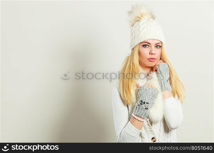 Clothing, fashion people. Attractive woman wearing winter clothes. Young lady has knitted wool sweater.