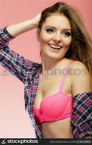 Clothing fashion people concept. Attractive lady wearing underwear. Young woman has long hair and shirt. Studio shot.. Attractive lady wearing underwear.