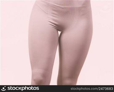 Clothing fashion sport concept. Fit female hips wearing thermoactive underwear. Slim woman in sporty clothes.. female hips wearing thermoactive underwear
