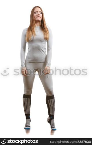 Clothing fashion sport concept. Fit female wearing thermoactive underwear, full body shot. Slim woman in sporty clothes. Fit female wearing thermoactive underwear