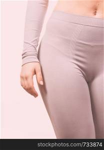 Clothing fashion sport concept. Part body picture with thermoactive underwear. Attractive fit woman promoting sporty clothes.. Part body picture with underwear.