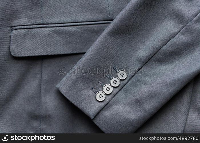 clothing, formal wear, fashion and objects concept - close up of business suit jacket