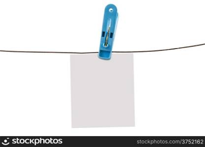 Clothing pin and wire with white paper isolated on white