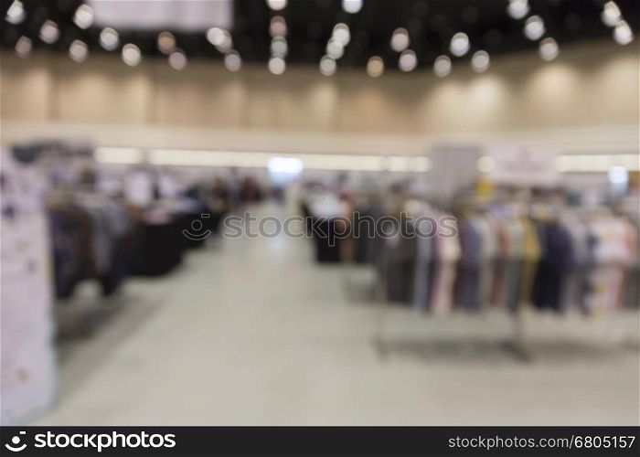clothing selling in department store for use as shopping concept, blur background with bokeh light