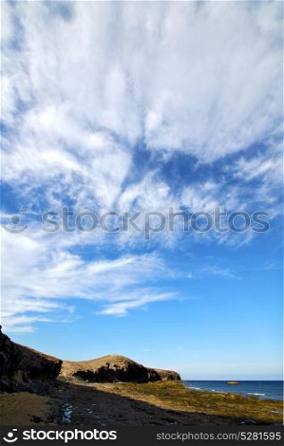 cloud beach water in lanzarote isle foam rock spain landscape stone sky