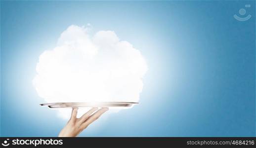 Cloud bubble. Human hand holding metal tray with cloud