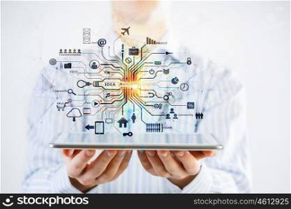 Cloud computing concept. Hand of businessman presenting tablet and cloud computing concept